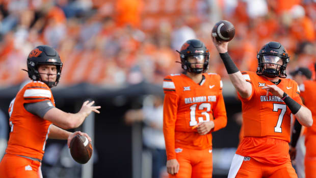 Sep 16, 2023; Stillwater, Oklahoma, USA; Oklahoma State Cowboys quarterback Alan Bowman (7), quarterback Gunnar Gundy (12) and quarterback Garret Rangel (13) warm up before an NCAA football game between Oklahoma State and South Alabama at Boone Pickens Stadium. Mandatory Credit: Bryan Terry-USA TODAY Sports  